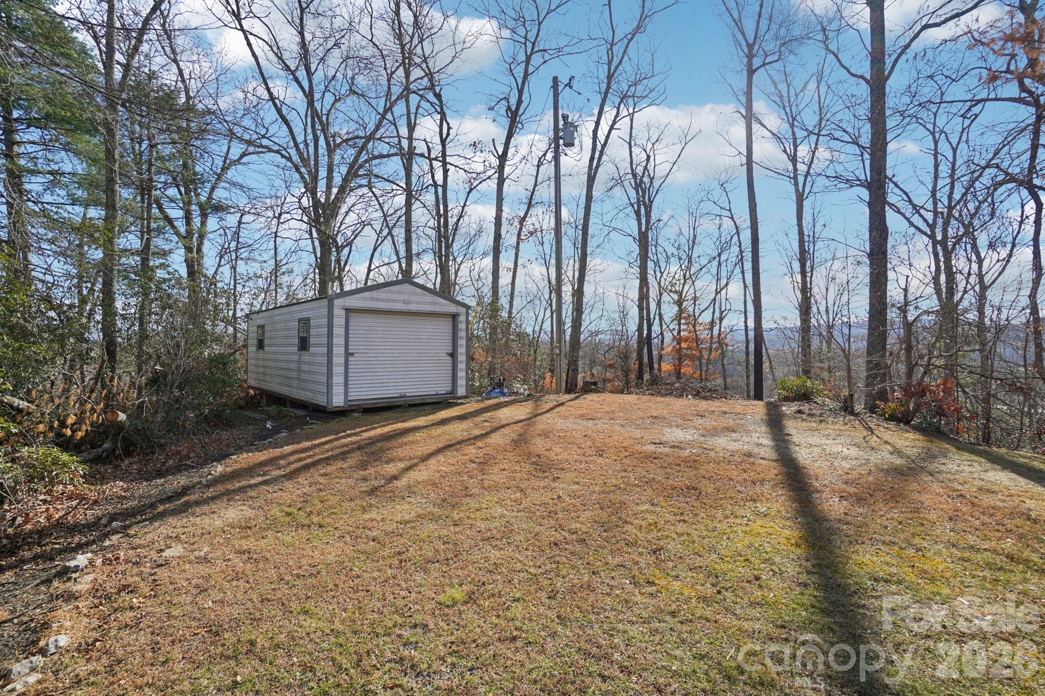 178 Rowe Court Hendersonville, NC 28792 - Photo 19 of 21 a house with trees in front of it