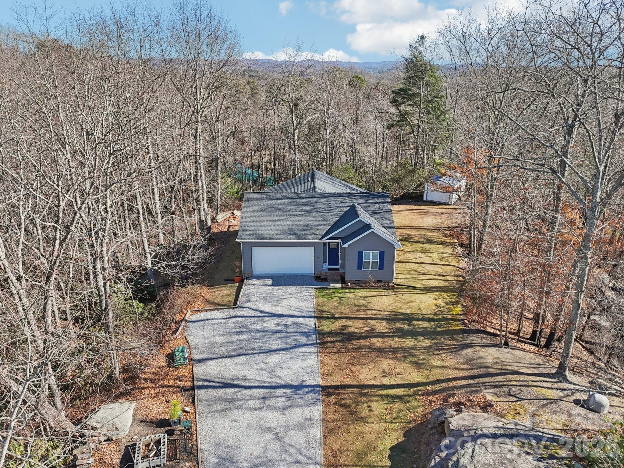 178 Rowe Court Hendersonville, NC 28792 - Photo 20 of 21 a view of a house with a yard