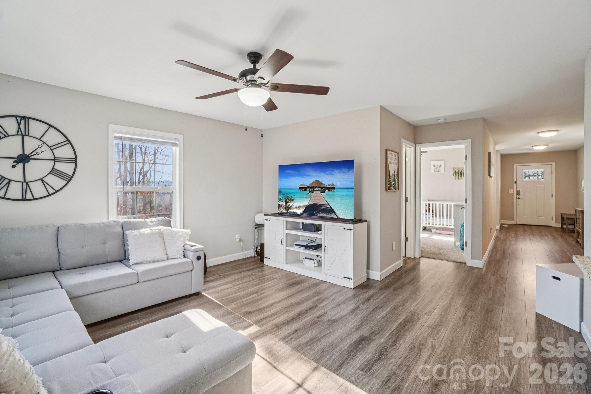 178 Rowe Court Hendersonville, NC 28792 - Photo 4 of 21 a living room with furniture and a wooden floor