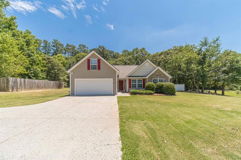 902 Downing Drive Bethlehem, GA 30620 - Photo 1 of 1 a front view of house with yard and trees in the background