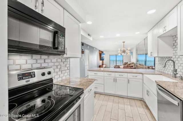 a kitchen with a stove and a microwave