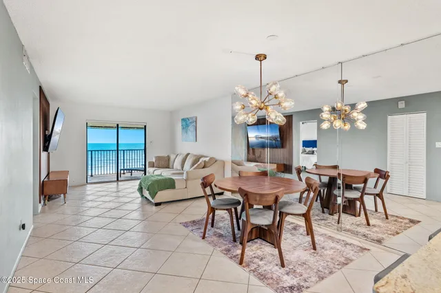 a large kitchen with a table and chairs