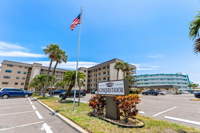 a view of swimming pool from a balcony