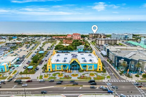 a view of a chairs and table in patio with a lake view
