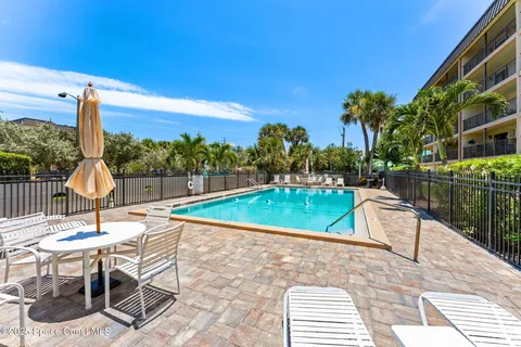 a view of swimming pool with outdoor seating