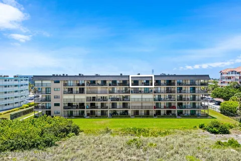 a view of a building with a garden