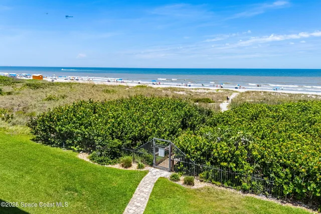 a bathroom with a shower curtain and a large window
