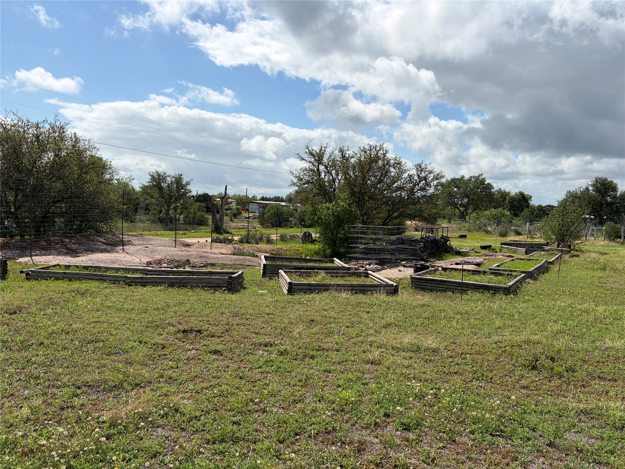 1060 Ranch Road 3404 Kingsland, TX 78639 - Photo 9 of 15 Raised garden and granite outcropping