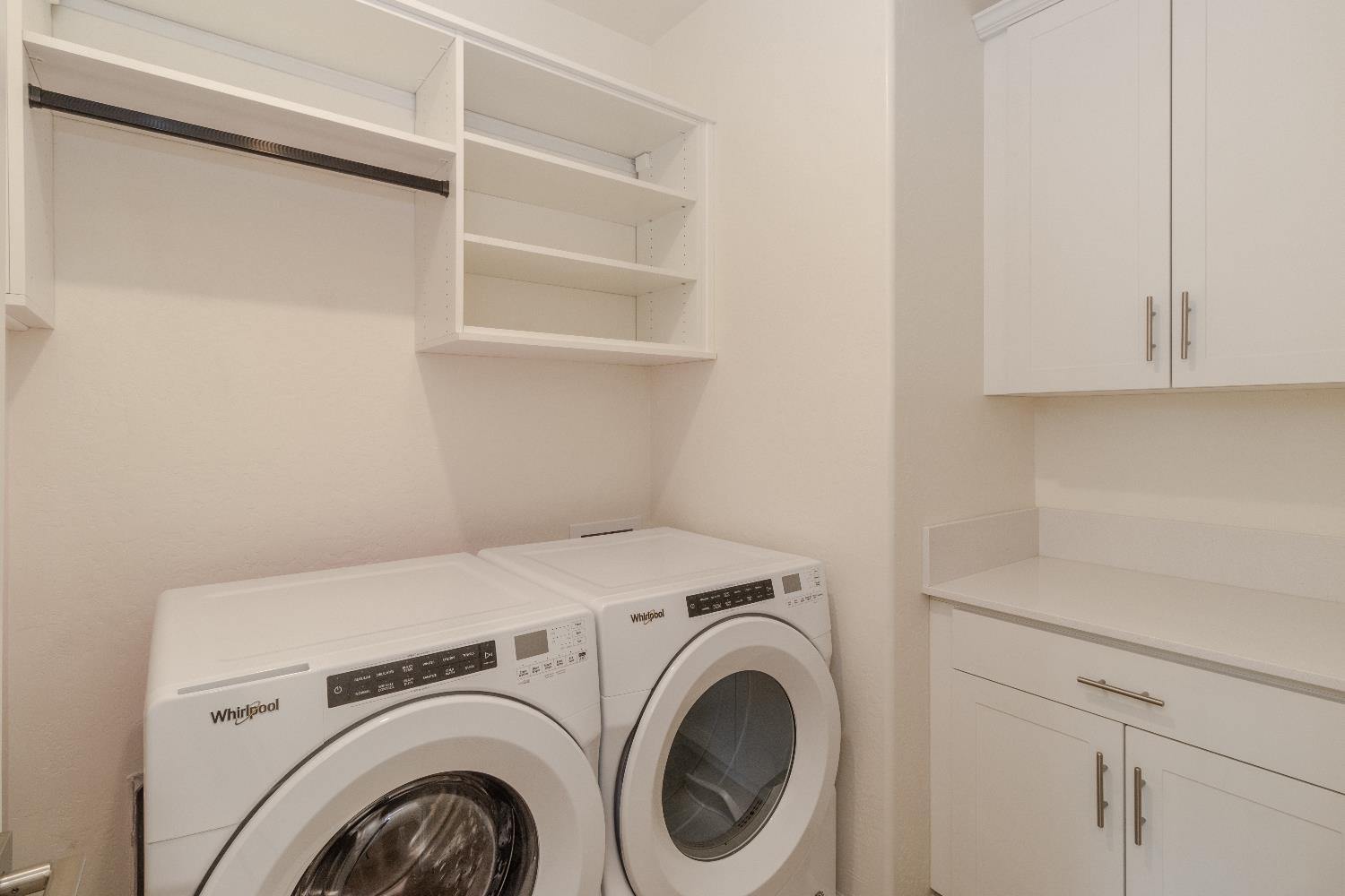 1158 Encore Way West Madera, CA 93636 - Photo 26 of 45 a utility room with dryer and washer