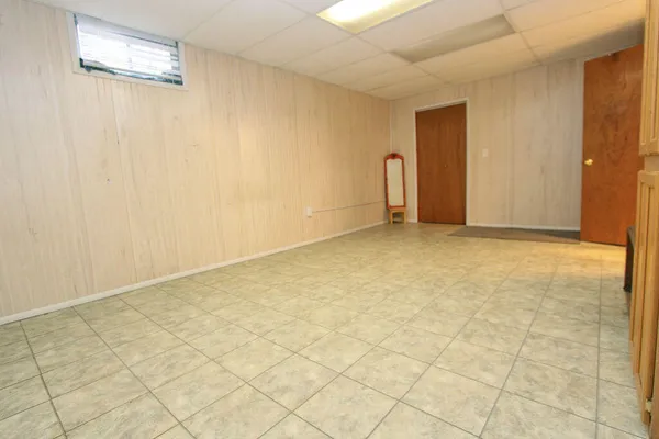 a view of an empty room and garage