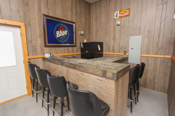 a kitchen with a table and chairs