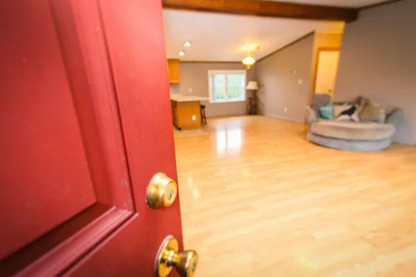 a view of a living room with a sink and chandelier