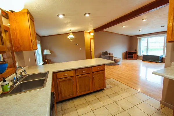 a spacious bathroom with a double vanity sink and a mirror