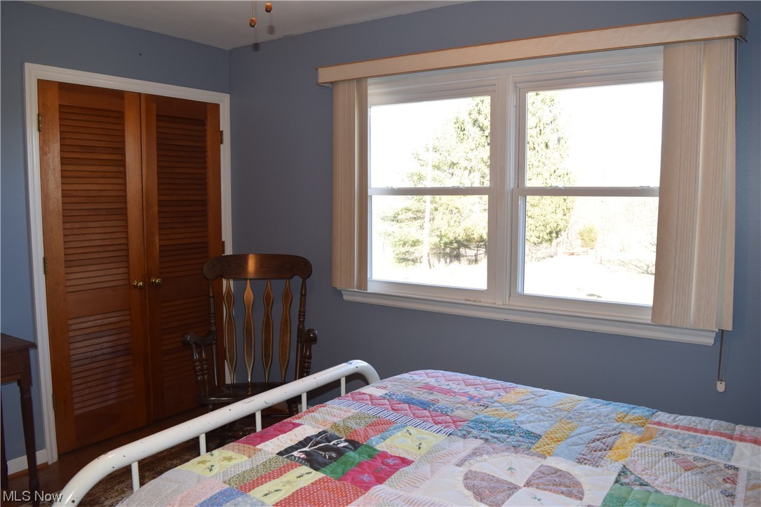 65578 Mathews Road Cambridge, OH 43725 - Photo 18 of 40 Bedroom with multiple windows and a closet