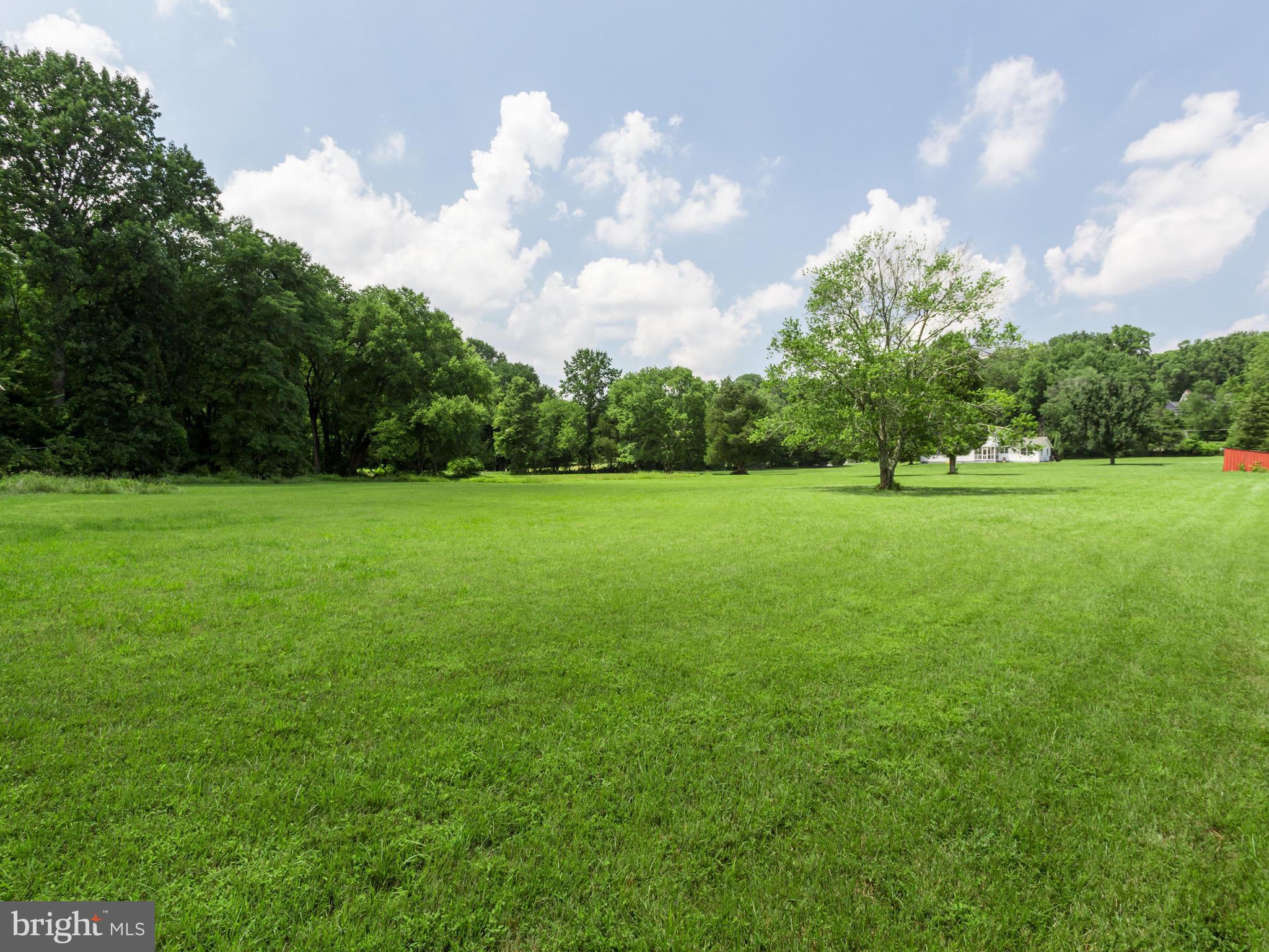11617 Stuart Mill Road Oakton, VA 22124 - Photo 1 of 30 a view of a green field with wooden fence