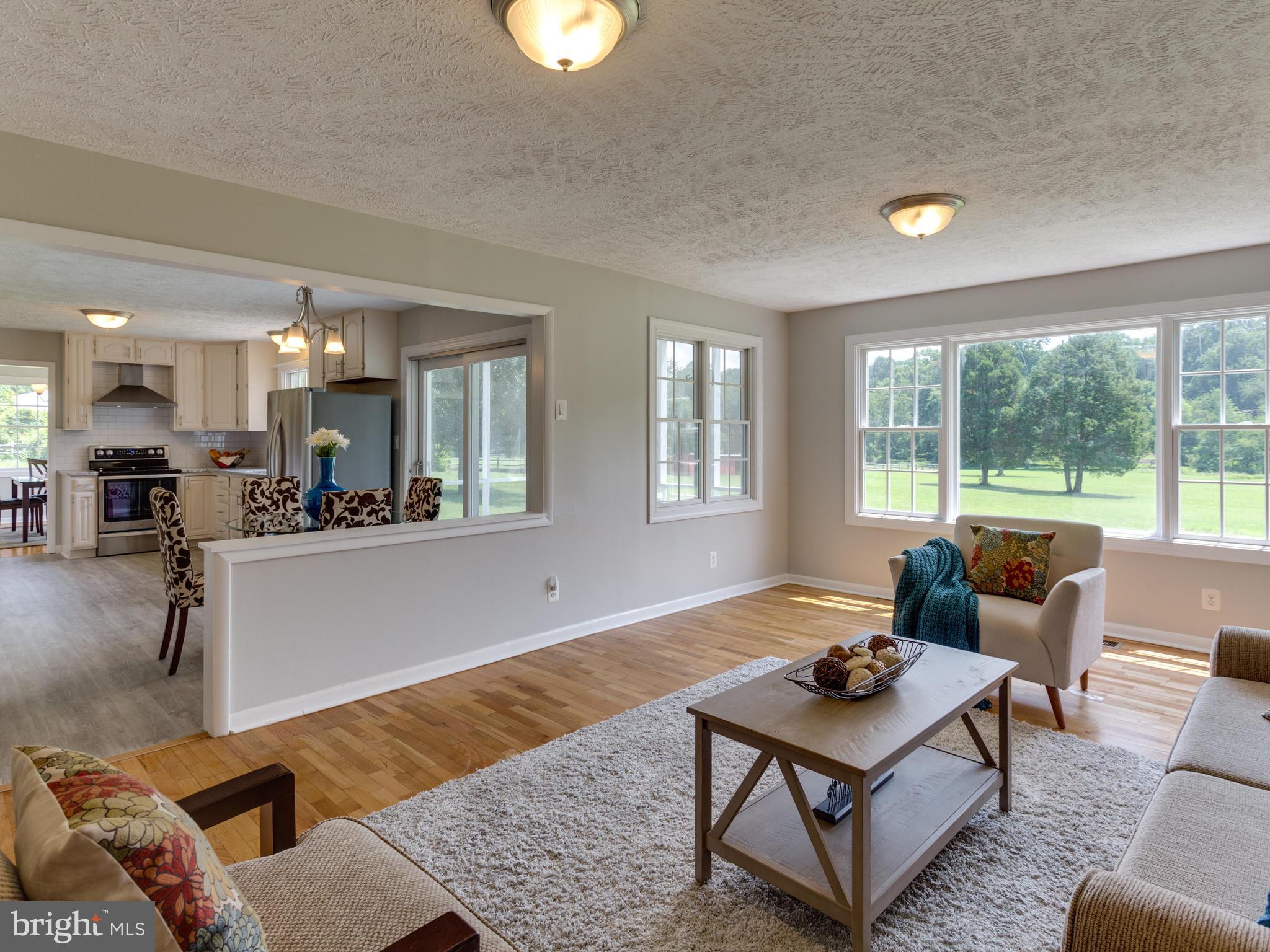 11617 Stuart Mill Road Oakton, VA 22124 - Photo 2 of 30 a living room with furniture and a large window
