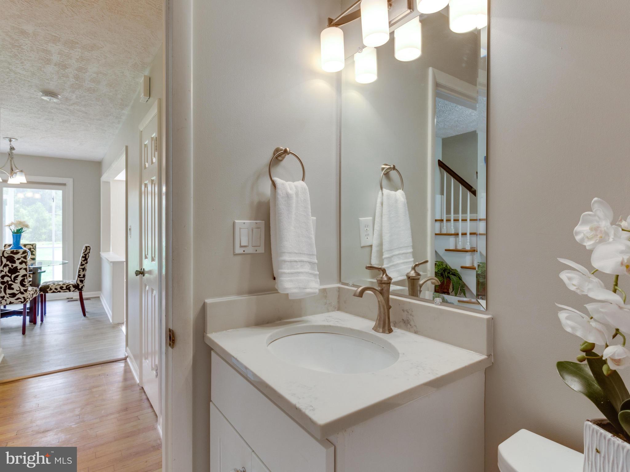 11617 Stuart Mill Road Oakton, VA 22124 - Photo 11 of 30 a bathroom with a sink vanity and a mirror