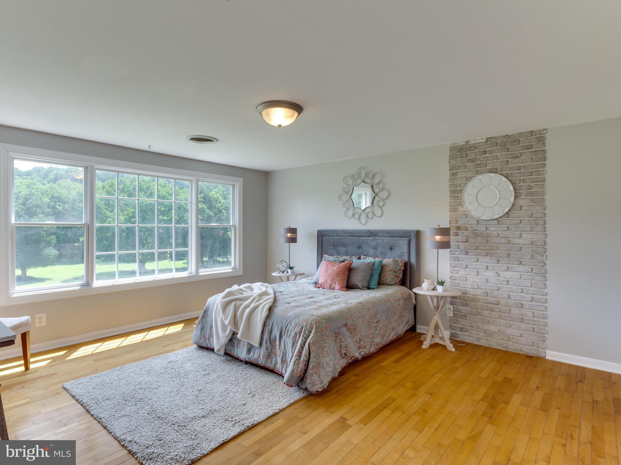 11617 Stuart Mill Road Oakton, VA 22124 - Photo 14 of 30 a bedroom with a bed and a window