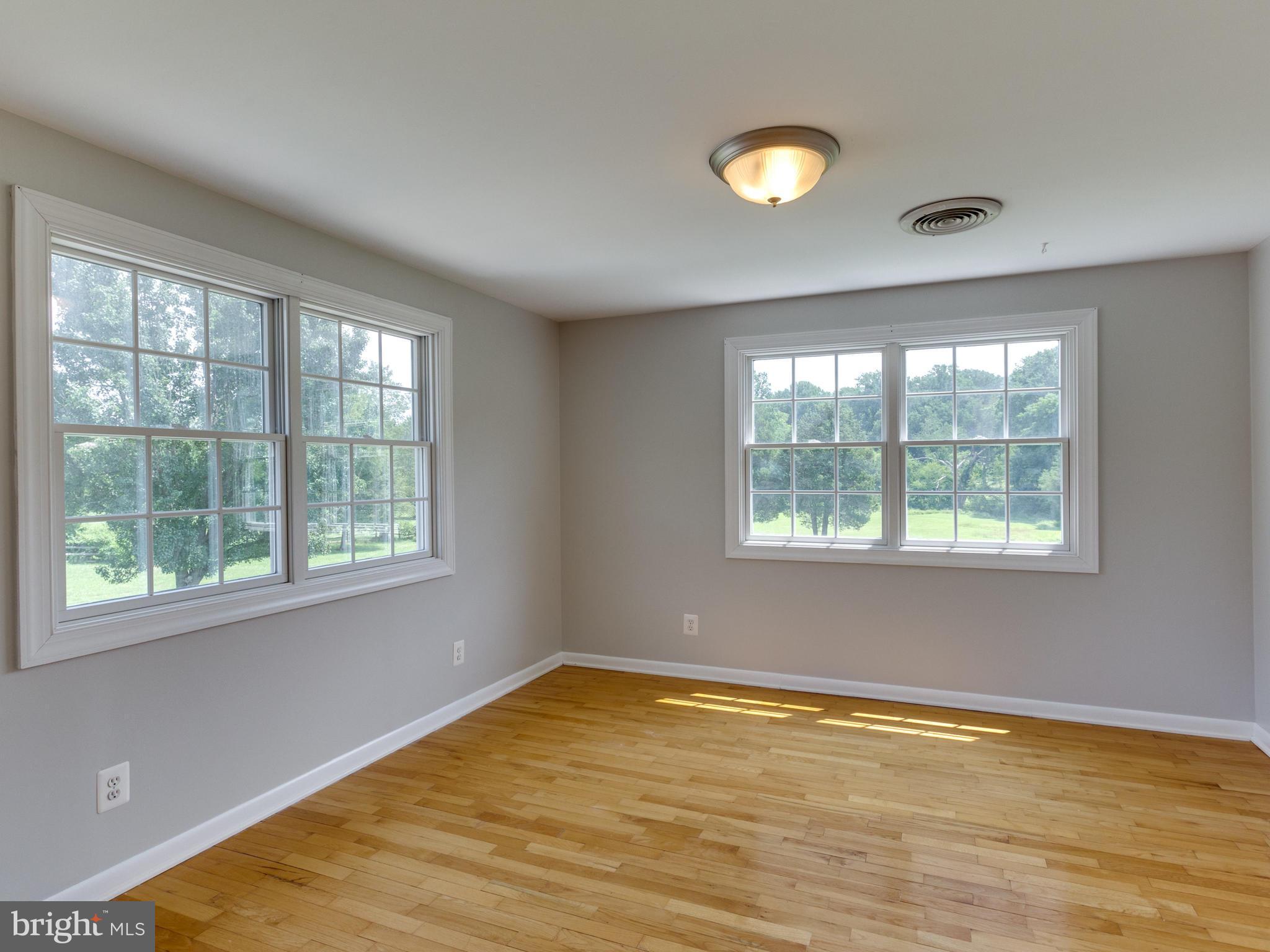 11617 Stuart Mill Road Oakton, VA 22124 - Photo 16 of 30 a view of an empty room with a window