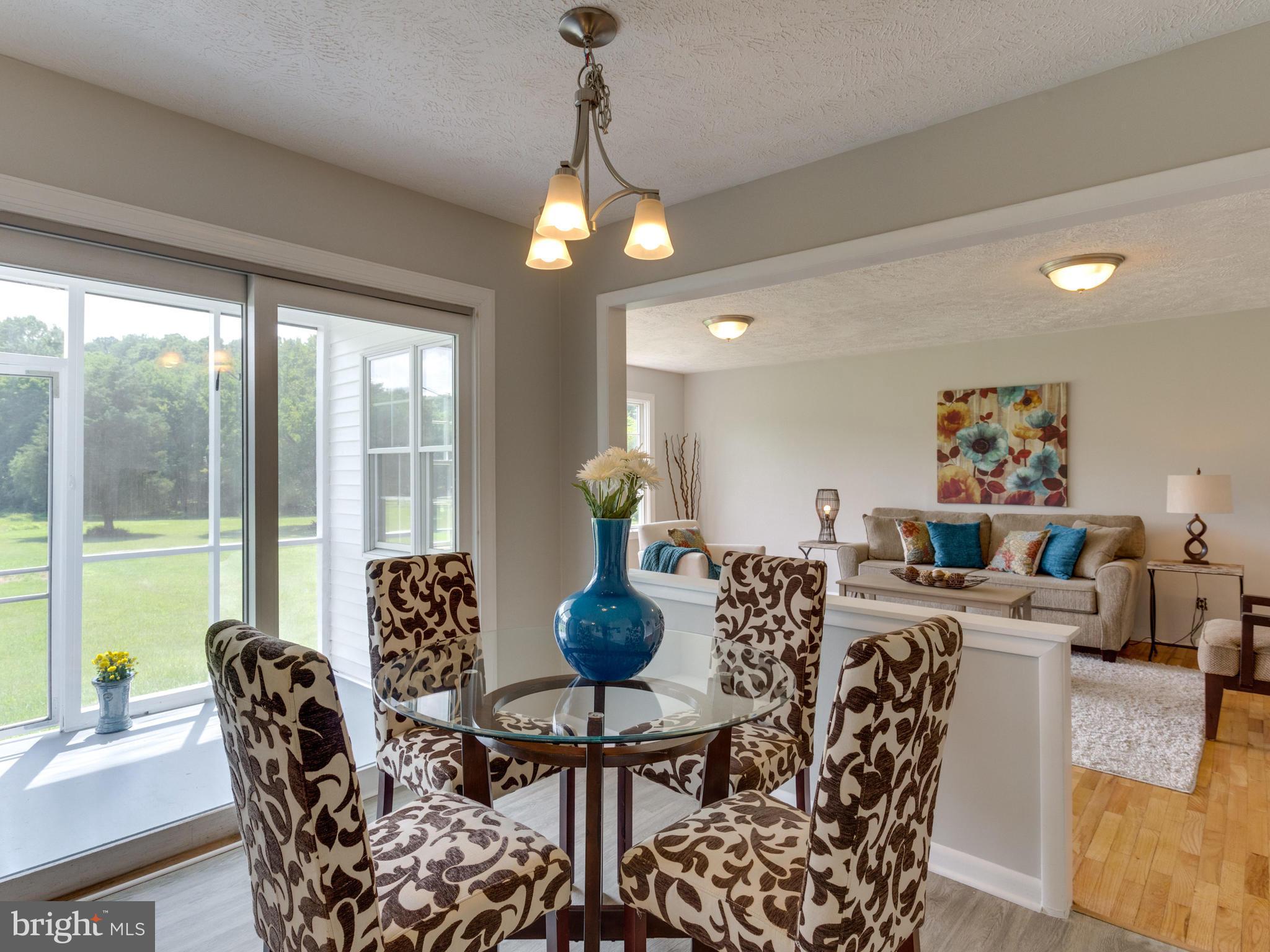 11617 Stuart Mill Road Oakton, VA 22124 - Photo 3 of 30 a view of a dining room with furniture window and outside view