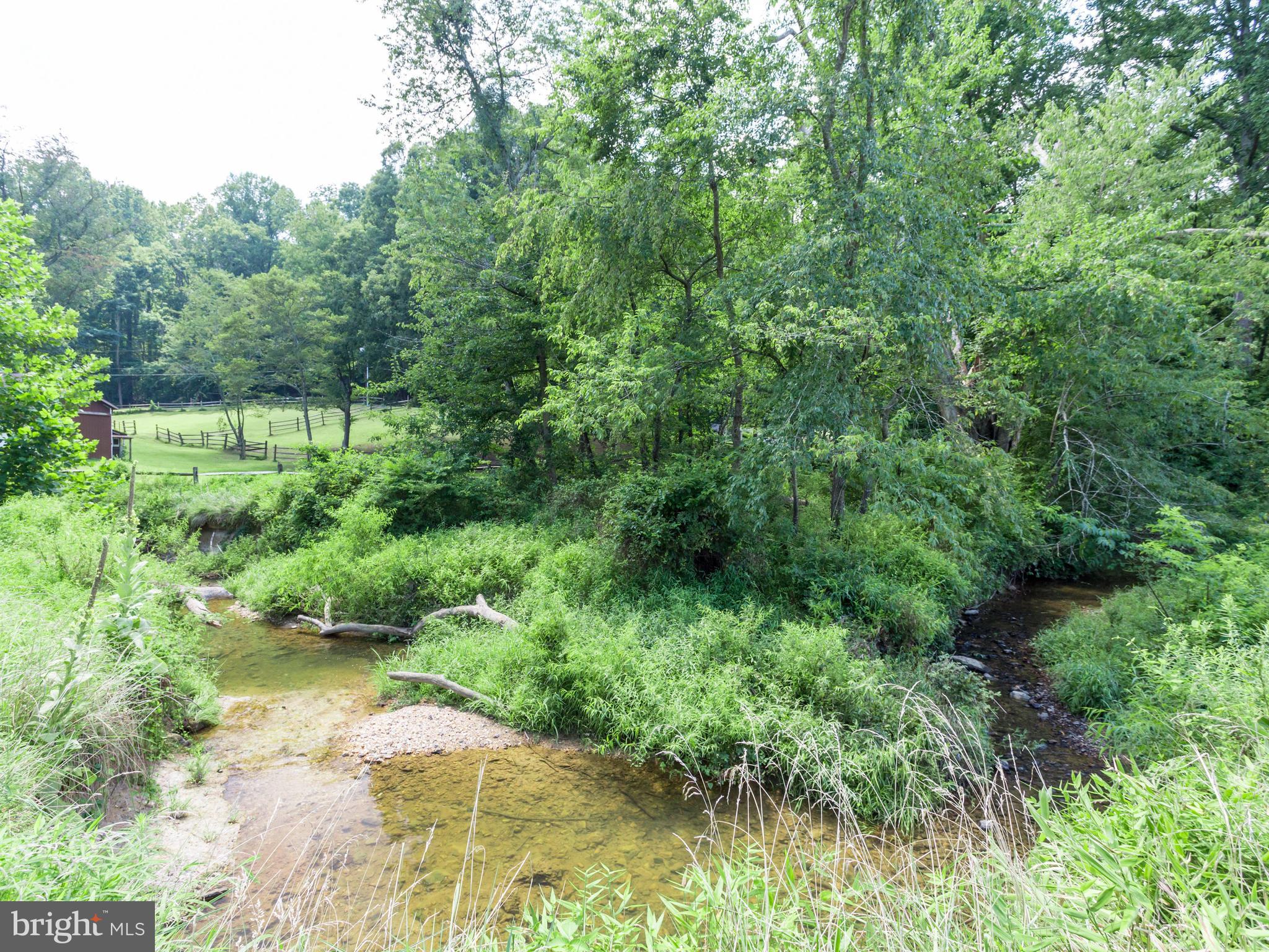 11617 Stuart Mill Road Oakton, VA 22124 - Photo 27 of 30 a view of a lake view with houses in back