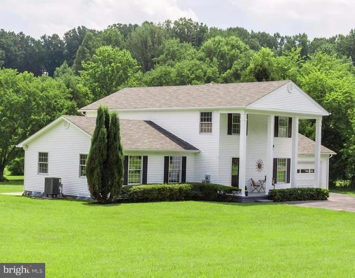 11617 Stuart Mill Road Oakton, VA 22124 - Photo 28 of 30 a front view of a house with a garden