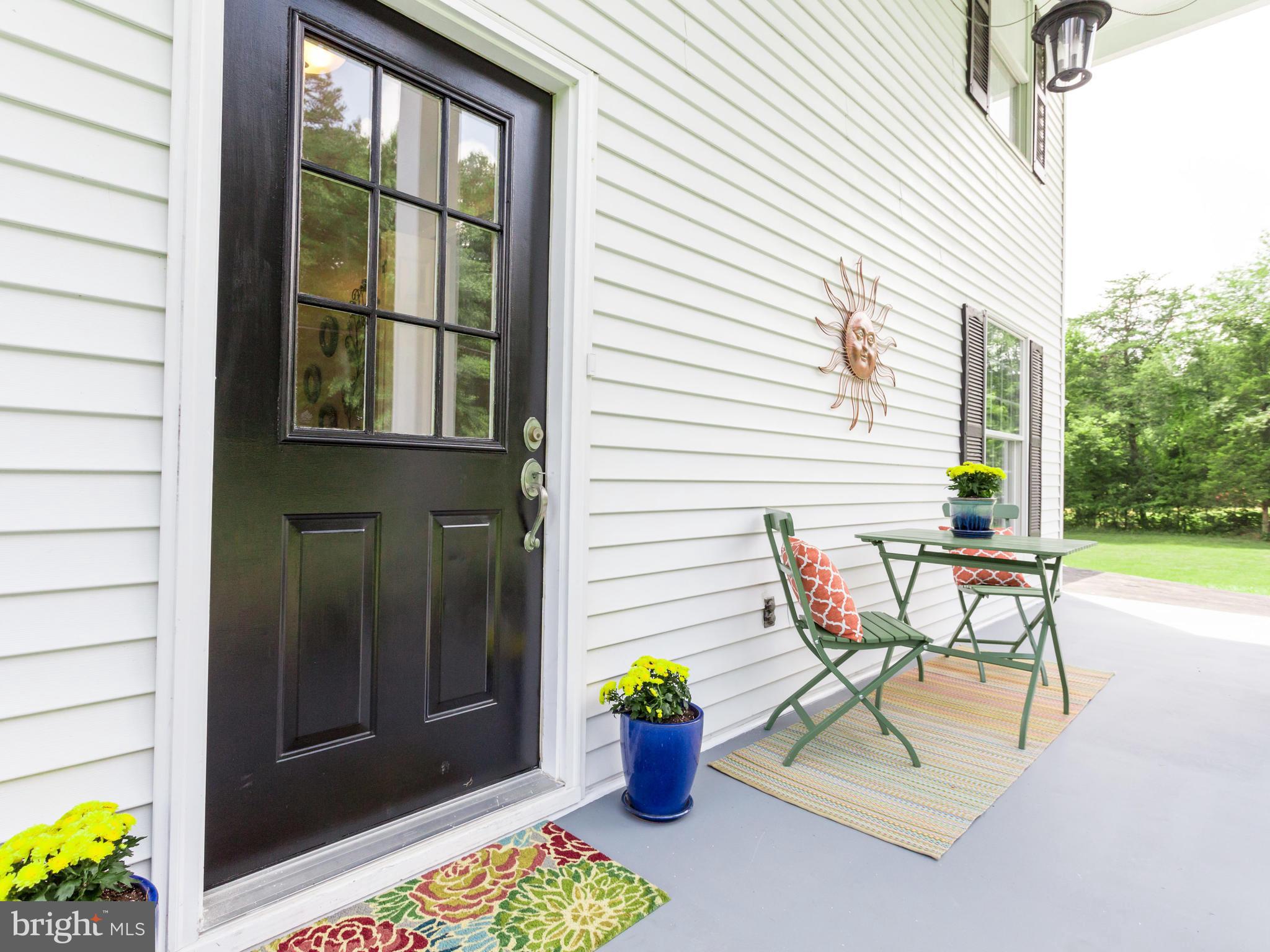 11617 Stuart Mill Road Oakton, VA 22124 - Photo 29 of 30 a view of a patio with table and chairs and potted plants