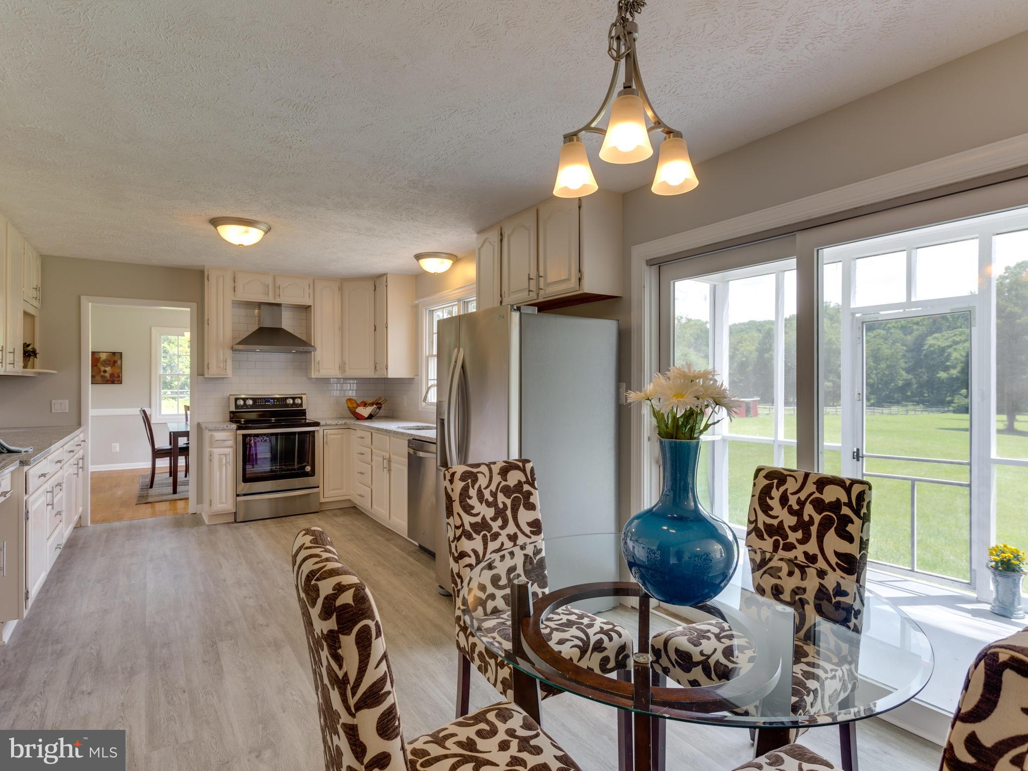 11617 Stuart Mill Road Oakton, VA 22124 - Photo 5 of 30 a living room with furniture and a large window