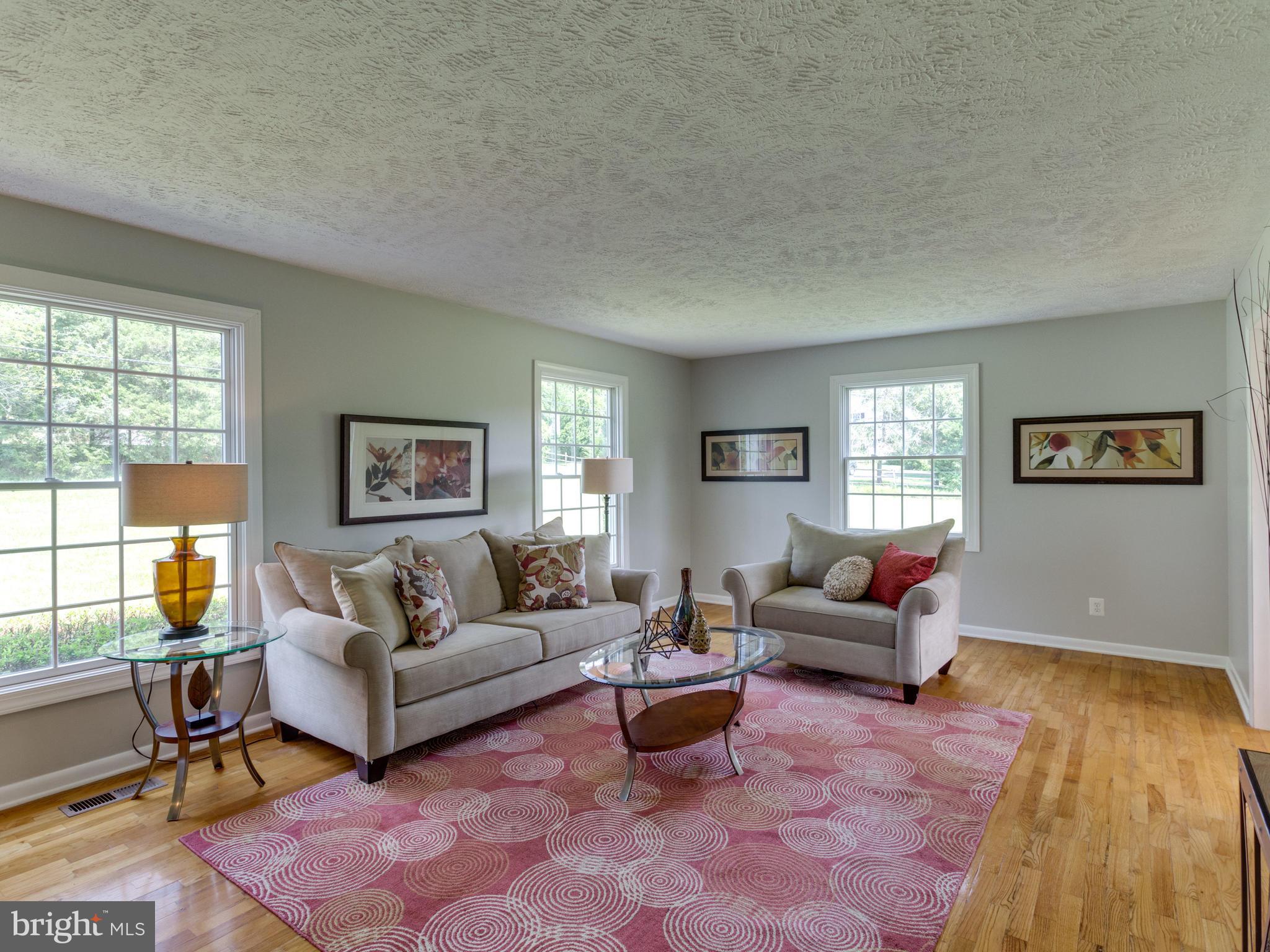 11617 Stuart Mill Road Oakton, VA 22124 - Photo 10 of 30 a living room with furniture and a window