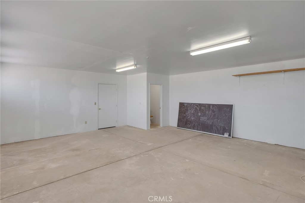 12736 Oasis Road Pinon Hills, CA 92372 - Photo 24 of 33 a view of an empty room with a window