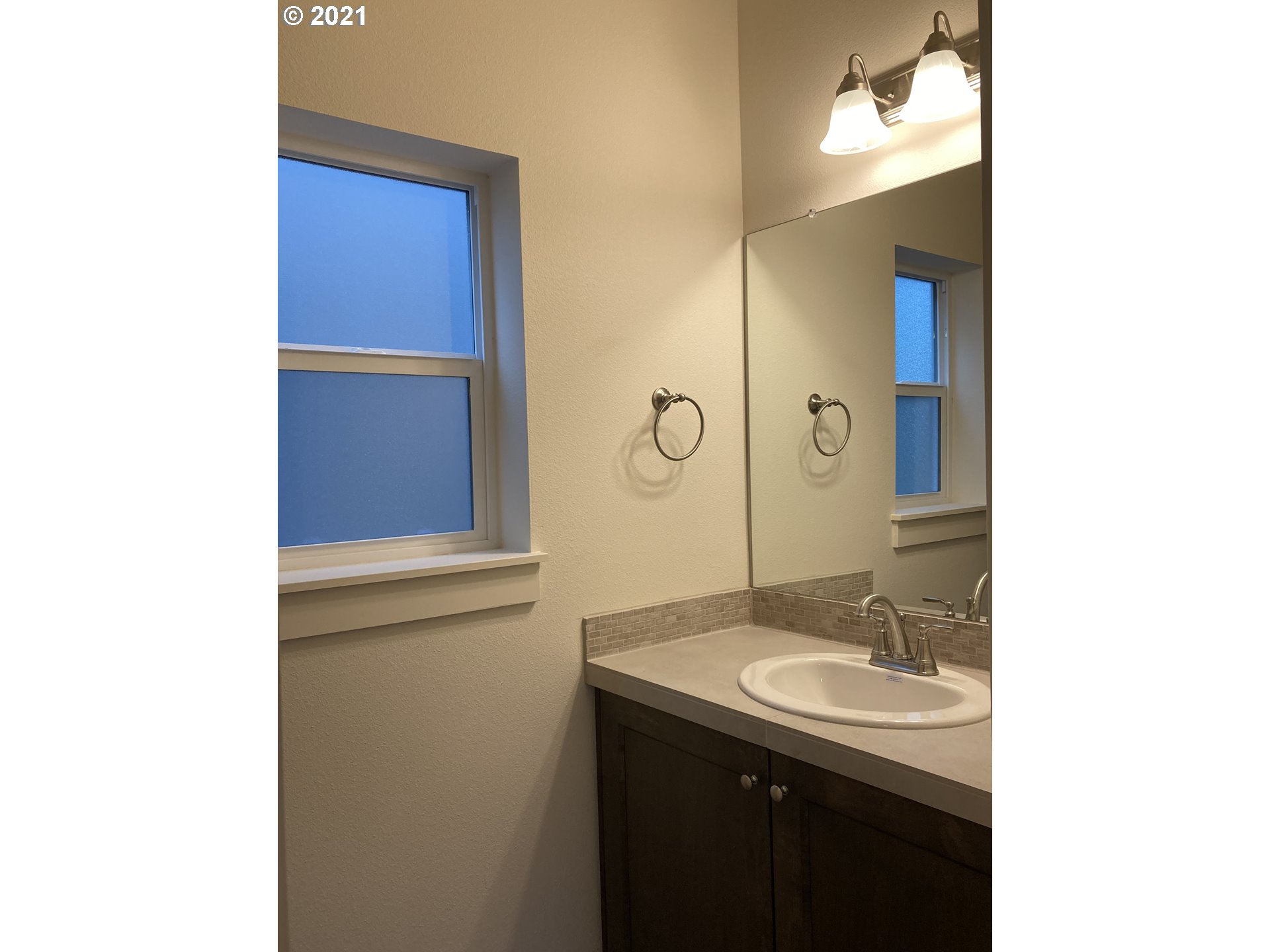 1251 South Union Place Ridgefield, WA 98642 - Photo 8 of 11 a bathroom with a sink and a mirror
