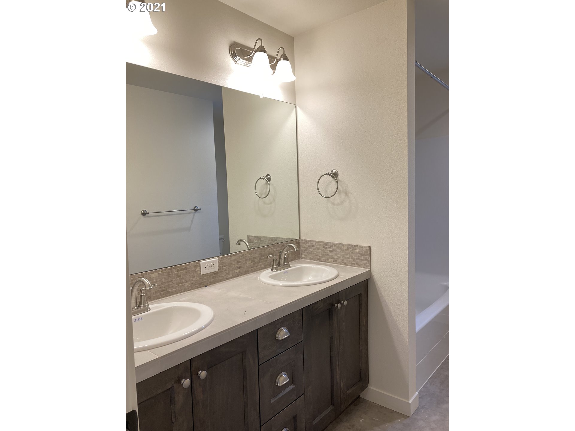 1251 South Union Place Ridgefield, WA 98642 - Photo 9 of 11 a bathroom with a sink and a mirror