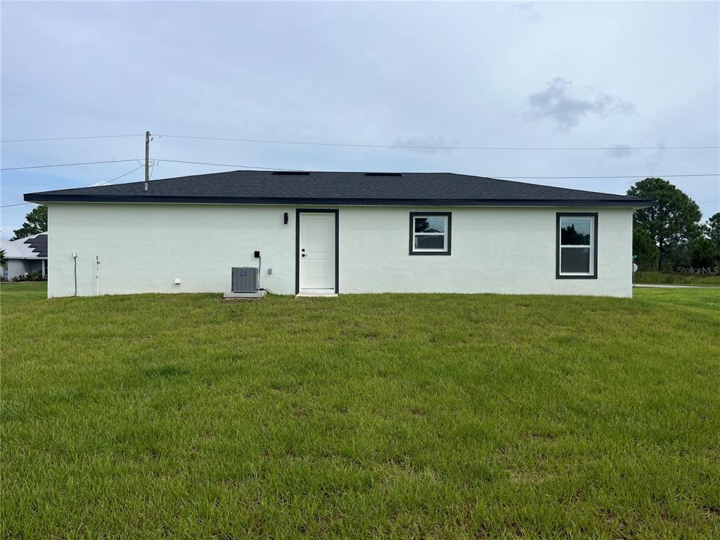 7209 Ancha Street Sebring, FL 33872 - Photo 20 of 20 a house view with a garden space