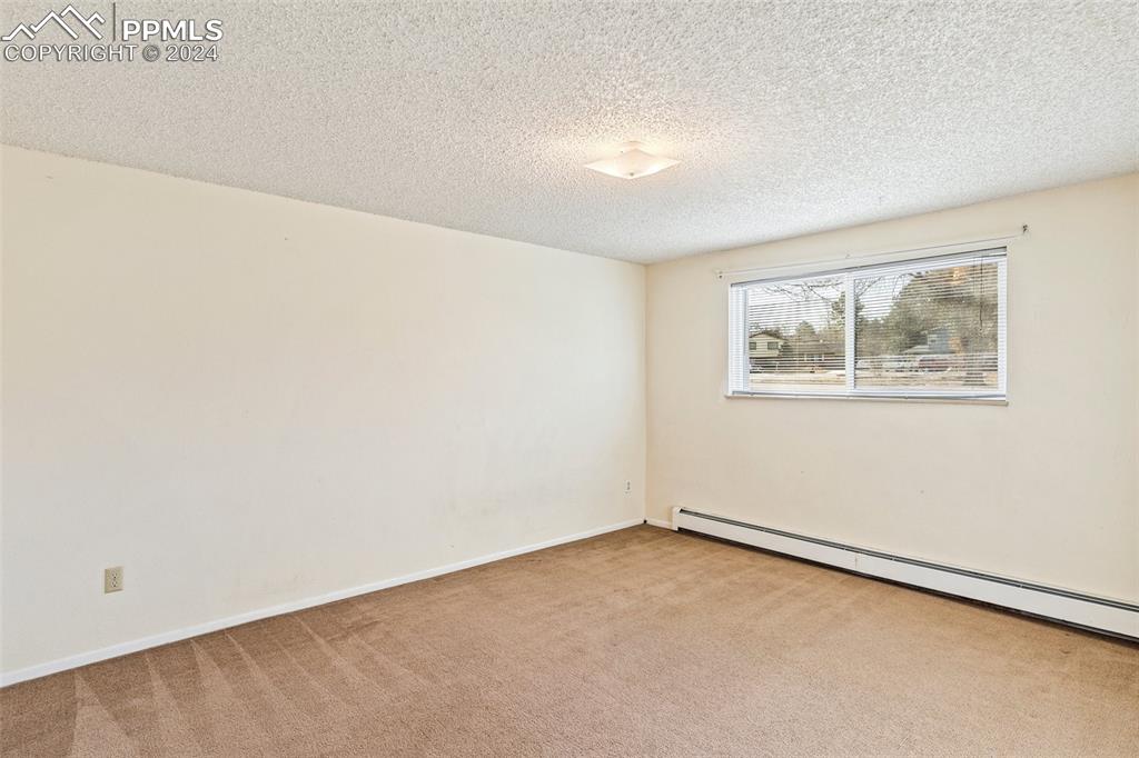 6602 Dublin Loop West, Unit 1 Colorado Springs, CO 80918 - Photo 14 of 23 an empty room with a window