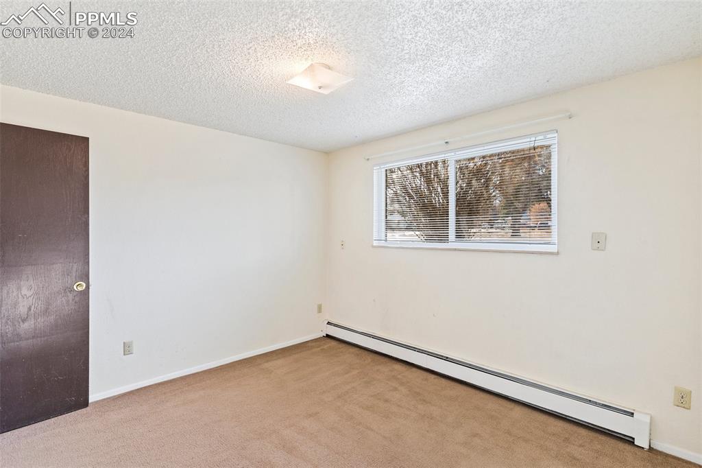 6602 Dublin Loop West, Unit 1 Colorado Springs, CO 80918 - Photo 17 of 23 a view of an empty room with a window
