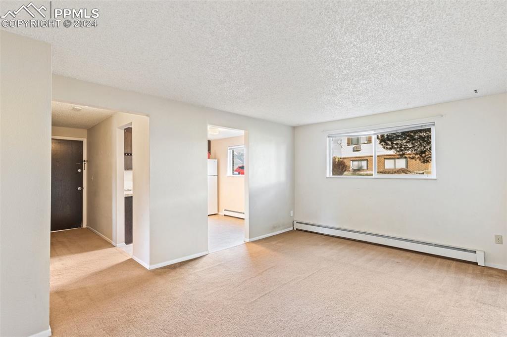 6602 Dublin Loop West, Unit 1 Colorado Springs, CO 80918 - Photo 5 of 23 an empty room with windows