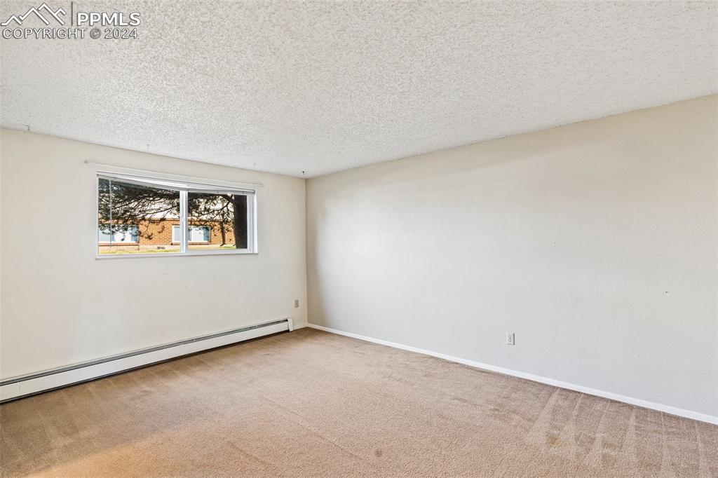 6602 Dublin Loop West, Unit 1 Colorado Springs, CO 80918 - Photo 6 of 23 an empty room with a window
