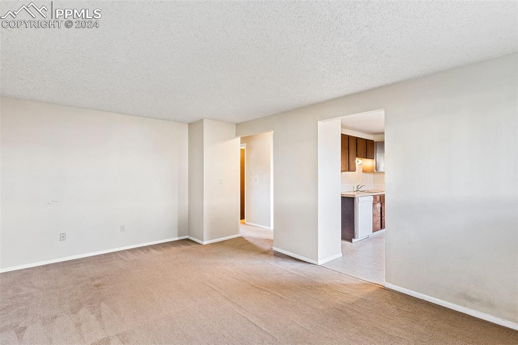 6602 Dublin Loop West, Unit 1 Colorado Springs, CO 80918 - Photo 8 of 23 a view of a room with a hallway