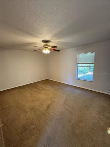 an empty room with a view of a livingroom