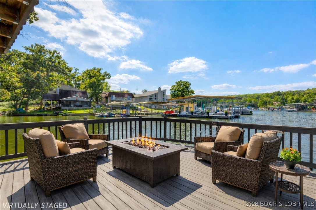 135 Seminole Road Sunrise Beach, MO 65079 - Photo 1 of 41 Martini Deck extended over the lake
