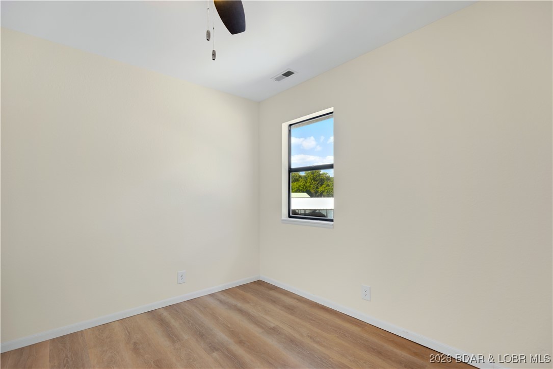 135 Seminole Road Sunrise Beach, MO 65079 - Photo 15 of 41 Main level bedroom