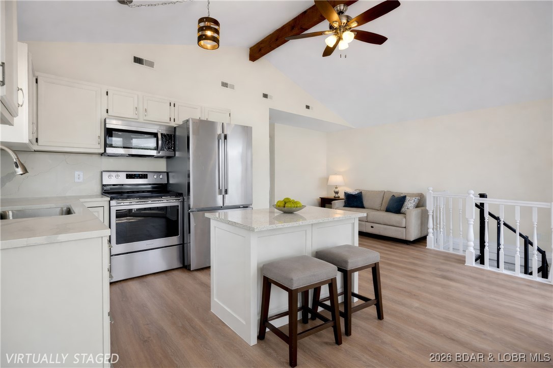 135 Seminole Road Sunrise Beach, MO 65079 - Photo 3 of 41 Main level kitchen - digitally staged