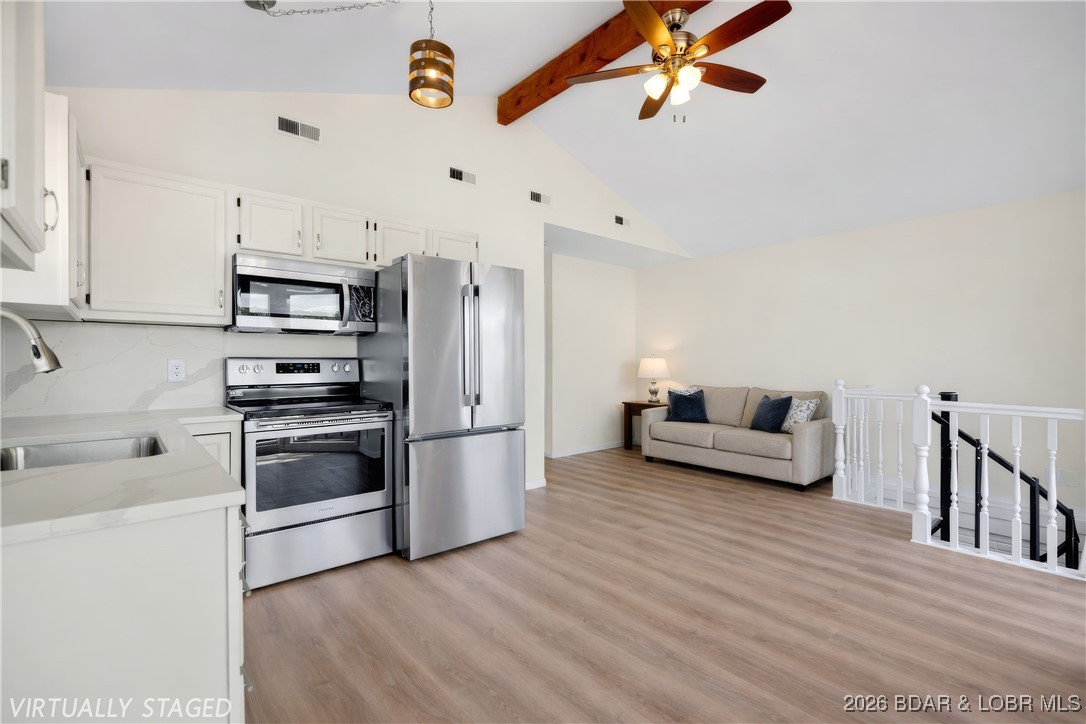 135 Seminole Road Sunrise Beach, MO 65079 - Photo 4 of 41 Main level kitchen - digitally staged