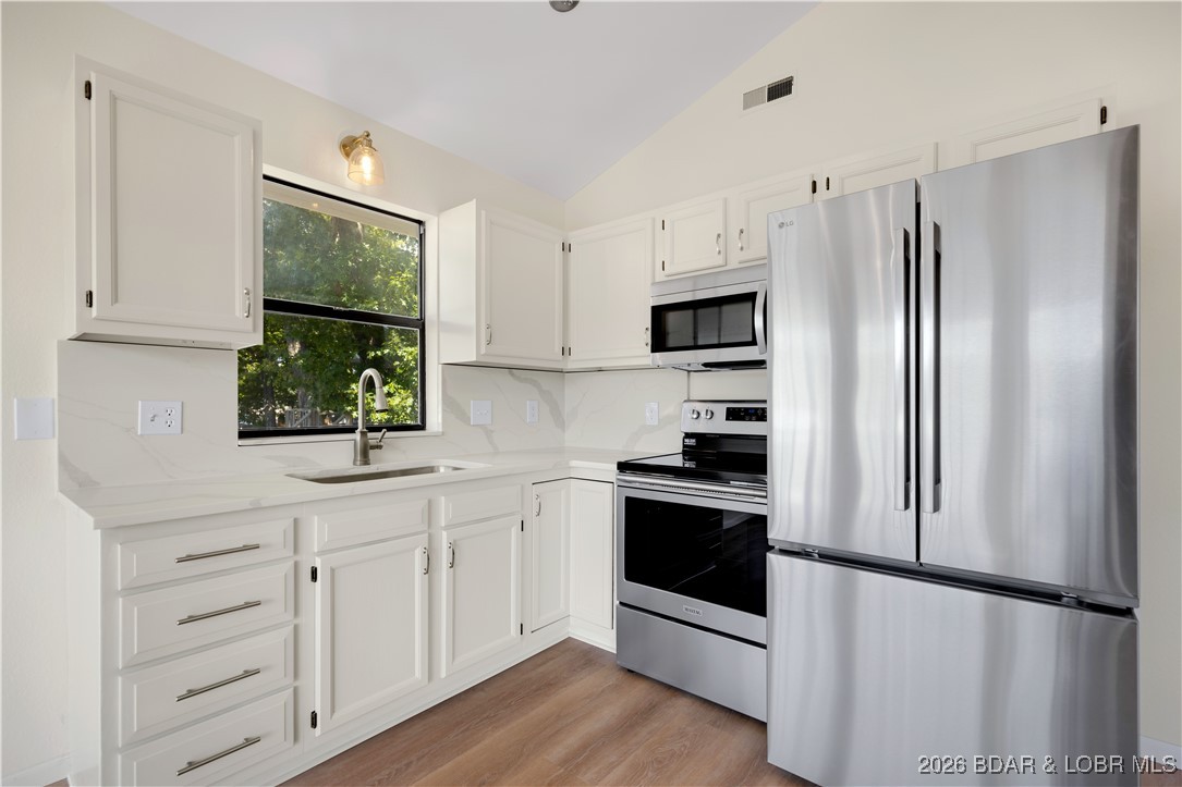 135 Seminole Road Sunrise Beach, MO 65079 - Photo 5 of 41 Main level kitchen