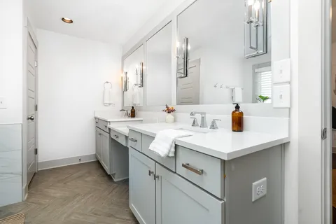 a view of bathroom with dual sinks