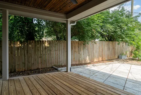 a backyard of a house with a fountain