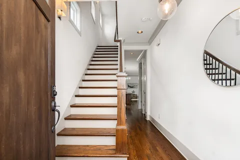a view of entryway with wooden floor