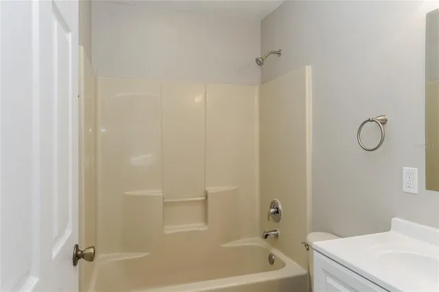 a bathroom with a tub and a shower