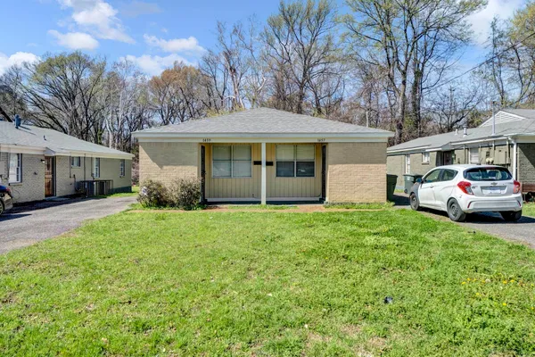 a view of a house with a garden