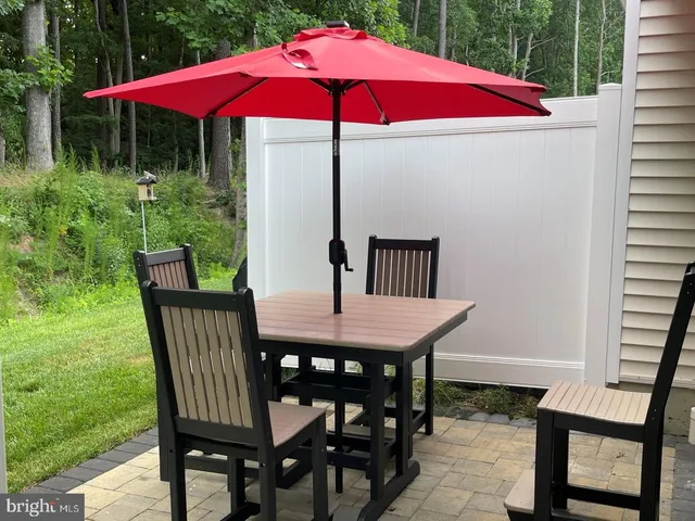 a view of a deck with furniture and backyard